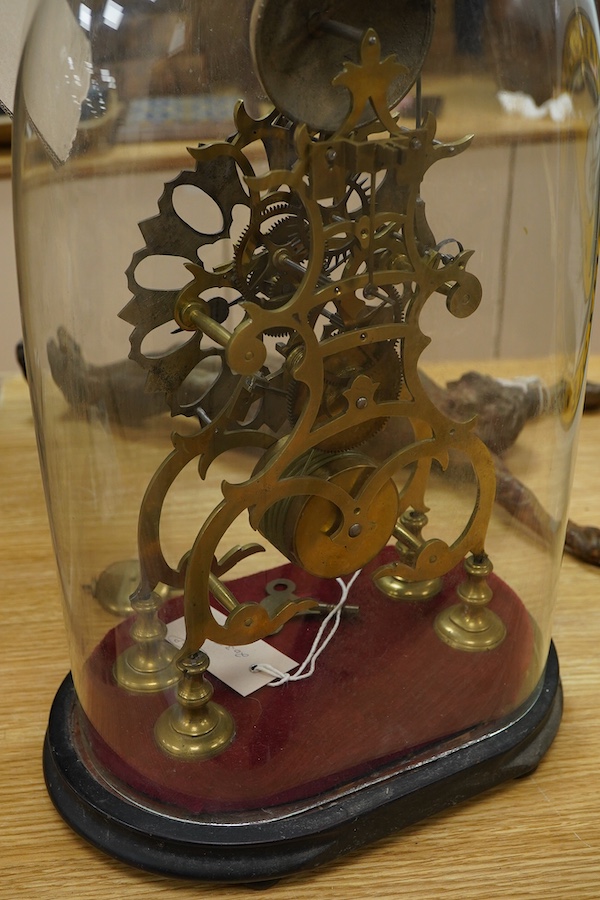 A Victorian brass framed skeleton clock, under a glass dome, 44cm